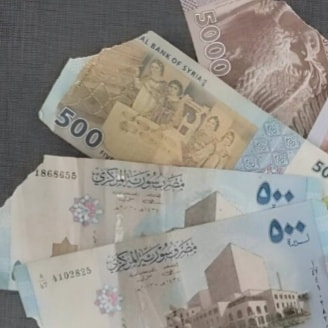 عدادات النقود تأكل أجزاء من العملة الورقية.. هل يمكن استبدالها؟